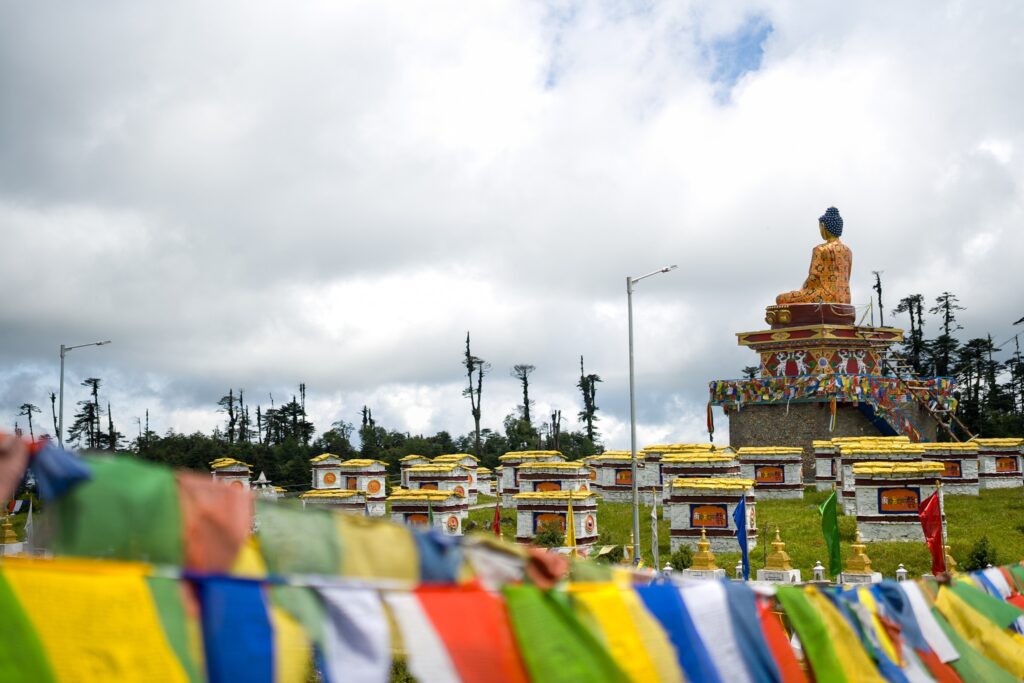 Prayer flags in warm monastery light, Tawang.